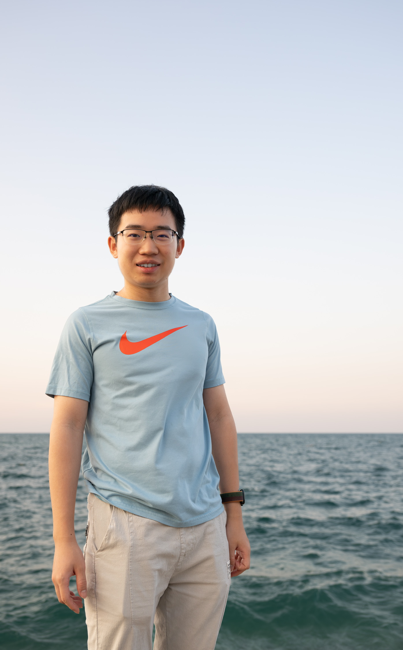 Yuchen Qiu standing by the sea